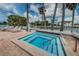 Relaxing hot tub surrounded by lush landscaping with waterfront views and community amenities at 5712 Biscayne Ct # 205, New Port Richey, FL 34652