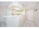 Bright kitchen with white cabinetry and a breakfast bar offers an inviting atmosphere at 5712 Biscayne Ct # 205, New Port Richey, FL 34652
