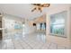 Living room with vaulted ceilings and a mirrored wall at 5712 Biscayne Ct # 205, New Port Richey, FL 34652