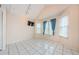 Bright living room with vaulted ceilings, and large windows at 5712 Biscayne Ct # 205, New Port Richey, FL 34652
