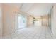 Living room featuring sliding glass door access to the balcony and tile floors at 5712 Biscayne Ct # 205, New Port Richey, FL 34652