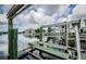Scenic waterfront features a boat lift and distant views of nearby homes at 5712 Biscayne Ct # 205, New Port Richey, FL 34652
