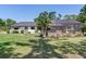 Well-maintained backyard boasts a screened pool and beautiful greenery for a private outdoor retreat at 6310 95Th E St, Bradenton, FL 34202