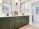 Stylish bathroom with double vanity, sleek mirrors, and modern fixtures at 6310 95Th E St, Bradenton, FL 34202