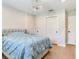 Bright bedroom featuring a chandelier, closet with sliding doors, and light wood flooring at 6310 95Th E St, Bradenton, FL 34202
