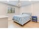Bright bedroom with a chandelier, a large window, and a comfortable bed with light blue bedding at 6310 95Th E St, Bradenton, FL 34202