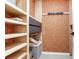 Walk-in closet featuring built-in shelving, drawers, and an open storage area for versatile organization at 6310 95Th E St, Bradenton, FL 34202