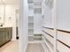 Walk-in closet with custom shelves and drawers offering ample storage and organization at 6310 95Th E St, Bradenton, FL 34202