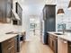 Modern kitchen featuring stainless steel appliances, sleek countertops, and dark cabinetry at 6310 95Th E St, Bradenton, FL 34202