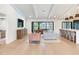 Bright living room with hardwood floors, featuring an open layout and access to the outdoors, great for entertaining at 6310 95Th E St, Bradenton, FL 34202