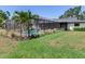 Inviting screened-in pool area surrounded by lush greenery, offering a private outdoor oasis at 6310 95Th E St, Bradenton, FL 34202