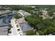 An aerial view shows this townhome with a pond, neighboring houses, and lush landscaping at 6617 Citrus Creek Ln, Tampa, FL 33625