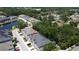 Aerial view of a residential community featuring a scenic pond and lush landscaping at 6617 Citrus Creek Ln, Tampa, FL 33625