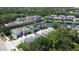 Aerial view of a residential neighborhood featuring a scenic pond and beautiful landscaping at 6617 Citrus Creek Ln, Tampa, FL 33625