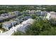 Aerial view of residential community featuring a scenic pond and lush landscaping at 6617 Citrus Creek Ln, Tampa, FL 33625