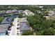 Aerial view of a community with a pond, mature trees and residential townhomes at 6617 Citrus Creek Ln, Tampa, FL 33625