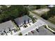 Aerial view of townhomes showing the roof and the surrounding lush landscaping in the neighborhood at 6617 Citrus Creek Ln, Tampa, FL 33625