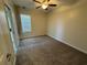 Bedroom featuring carpet, ceiling fan, and a neutral paint color at 6617 Citrus Creek Ln, Tampa, FL 33625