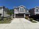 Charming two-story townhome with a two-car garage and well-maintained landscaping at 6617 Citrus Creek Ln, Tampa, FL 33625
