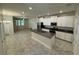 This spacious kitchen has granite countertops and stainless steel appliances at 6617 Citrus Creek Ln, Tampa, FL 33625