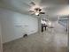 Open-concept living room flows into a modern kitchen with stainless steel appliances and island at 6617 Citrus Creek Ln, Tampa, FL 33625