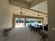 Community pool area with seating, tables, and covered dining area with ceiling fans at 6617 Citrus Creek Ln, Tampa, FL 33625