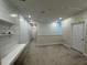 Carpeted upstairs landing with built-in desk and access to the laundry room and bedrooms at 6617 Citrus Creek Ln, Tampa, FL 33625