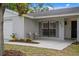 Cozy front porch with chairs and decorative plants creates a welcoming entrance to the home at 6712 Jennifer Dr, Temple Terrace, FL 33617