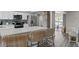 Modern kitchen with white cabinets, stainless steel appliances, and a large island with counter seating at 6712 Jennifer Dr, Temple Terrace, FL 33617