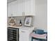 Kitchen counter with modern cabinets, wine cooler, and space for wine accessories and decor at 6712 Jennifer Dr, Temple Terrace, FL 33617