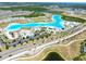 Aerial view of a neighborhood featuring a lagoon, common areas, and many single Gathering homes at 7486 Tuscan Bay Cir, Wesley Chapel, FL 33545