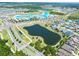 Aerial view of a neighborhood featuring a lagoon, pond, common areas, and many single Gathering homes at 7486 Tuscan Bay Cir, Wesley Chapel, FL 33545