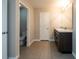 Bathroom features a double vanity, neutral color palette, and a separate toilet room at 7486 Tuscan Bay Cir, Wesley Chapel, FL 33545
