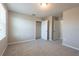 Bright bedroom with neutral paint, carpeted floor, and multiple entry doors at 7486 Tuscan Bay Cir, Wesley Chapel, FL 33545