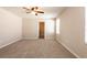 Large bedroom featuring carpet flooring, ceiling fan, and natural light at 7486 Tuscan Bay Cir, Wesley Chapel, FL 33545