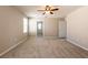 A spacious bedroom featuring carpeted floors, neutral walls, and ceiling fan at 7486 Tuscan Bay Cir, Wesley Chapel, FL 33545