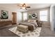 Serene bedroom with neutral tones, natural light, and stylish decor, creating a relaxing and inviting space at 7486 Tuscan Bay Cir, Wesley Chapel, FL 33545