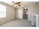 Upstairs bedroom featuring neutral walls, carpet flooring, and a ceiling fan at 7486 Tuscan Bay Cir, Wesley Chapel, FL 33545