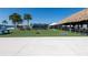 Beautiful community area with a tiki hut, bar, picnic tables, ping pong and lawn games at 7486 Tuscan Bay Cir, Wesley Chapel, FL 33545