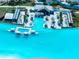 Aerial view of the swim-up bar, lounge areas, and pools at the lagoon at 7486 Tuscan Bay Cir, Wesley Chapel, FL 33545