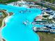 Aerial shot of a lagoon's seating areas, waterpark, and beach at 7486 Tuscan Bay Cir, Wesley Chapel, FL 33545