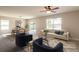 Elegant living room featuring a comfortable sofa, chairs, and natural light, perfect for relaxing and entertaining guests at 7486 Tuscan Bay Cir, Wesley Chapel, FL 33545