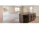 Open concept living room with adjacent kitchen; perfect for entertaining and gatherings at 7486 Tuscan Bay Cir, Wesley Chapel, FL 33545