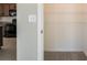 View of the pantry with metal shelving, providing ample storage adjacent to the kitchen at 7486 Tuscan Bay Cir, Wesley Chapel, FL 33545