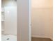 Modern bathroom with a large shower, neutral color palette and shelving for bathroom items at 7486 Tuscan Bay Cir, Wesley Chapel, FL 33545