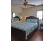 Comfortable bedroom featuring wood-look floors and ample natural light at 7503 N Howard Ave, Tampa, FL 33604