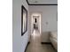 Hallway featuring tile floors and neutral paint at 7503 N Howard Ave, Tampa, FL 33604