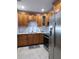 Well-equipped kitchen featuring modern stainless steel appliances and granite countertops at 7503 N Howard Ave, Tampa, FL 33604