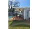Covered patio with comfortable seating, offering a relaxing outdoor living space overlooking pool at 7503 N Howard Ave, Tampa, FL 33604
