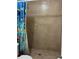 Tile shower with a unique shower base, and a vibrant shower curtain at 7503 N Howard Ave, Tampa, FL 33604